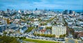 Aerial The Painted Ladies with wide view of San Francisco city skyscrapers under pretty blue sky