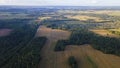 Aerial panorama of autumn farmlands with small village. Beautiful rural landscape with harvested from the field. Royalty Free Stock Photo