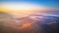Aerial panorama of autumn mountains. Sunrise over foggy valley Royalty Free Stock Photo