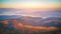 Aerial panorama of autumn mountains. Sunrise over mountain foggy valley Royalty Free Stock Photo