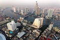 Aerial panorama of Bangkok City in the  morning light with Taksin Bridge over Chao Phraya River & modern skyscrapers & hotels by r Royalty Free Stock Photo