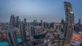 Aerial panorama of a big futuristic city night to day timelapse. Business bay and Downtown