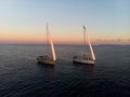 Aerial panorama of boat sailboat ship sailing into sunset mediterranean sea ocean water Mallorca Balearic Islands Spain Royalty Free Stock Photo