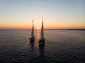 Aerial panorama of boat sailboat ship sailing into sunset mediterranean sea ocean water Mallorca Balearic Islands Spain Royalty Free Stock Photo