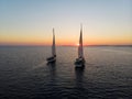 Aerial panorama of boat sailboat ship sailing into sunset mediterranean sea ocean water Mallorca Balearic Islands Spain Royalty Free Stock Photo