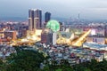 Aerial panorama of busy Taipei City in twilight with view of a giant ferris wheel in Dazhi Commercial District and taipei 101 in d Royalty Free Stock Photo