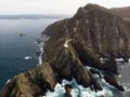 Aerial panorama of Cabo Ortegal lighthouse on steep rocky cliff atlantic ocean bay of biscay Carino Cape Galicia Spain