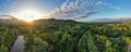 Aerial panorama of Cairns Botanical garden at sunset showing the rainforrest and Cairns city Royalty Free Stock Photo