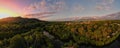 Aerial panorama of Cairns Botanical garden at sunset showing the rainforrest and orange and red sky Royalty Free Stock Photo