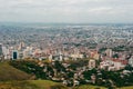 Aerial panorama of the city of Cali taken from the top of Cristo del Rey against a blue sky. Colombia