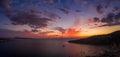 Aerial panorama drone shot of sunset burning sky clouds on Komiza town over Vis Island in Croatia Summer Royalty Free Stock Photo