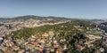 Aerial panorama drones shot of park on hill outside Barcelona city in Spain winter morning