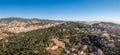 Aerial panorama drones shot of park on hill outside Barcelona city in Spain winter morning