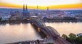 Aerial panorama of the Hohenzollern bridge over Rhine riverat sunset. Beautiful cityscape of Cologne, Germany Royalty Free Stock Photo