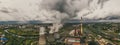 Aerial panorama of industrial area with chimneys of thermal power plant or station with smoke and other industry buildings Royalty Free Stock Photo