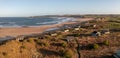 Aerial view of remote beach huts on the Northumberland coast at Embleton Bay Royalty Free Stock Photo