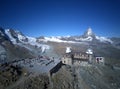 Aerial panorama of majestic mountain Matterhorn in morning sunlight with the famous Gornergrat Observatory