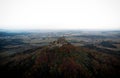 Aerial panorama of medieval gothic mountain hilltop castle Burg Hohenzollern Hechingen Swabian Jura alps autumn Germany Royalty Free Stock Photo