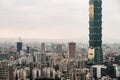 Aerial panorama over Downtown Taipei with Taipei 101 Skyscraper with trees on mountain in foreground from Xiangshan.