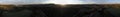 Aerial panorama over hills and polo fields at sunset Royalty Free Stock Photo