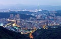 Aerial panorama of overpopulated suburban communities in Taipei at dusk with view of Taipei 101 Tower in downtown & bridges Royalty Free Stock Photo