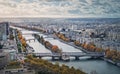 Aerial panorama of Paris city, France. Multiple bridges over the Seine river and vibrant colored autumn trees on the riverbank. Royalty Free Stock Photo