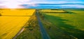 Aerial panorama of rural road passing through agricultural land in Australian countryside at sunset. Royalty Free Stock Photo