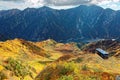 Aerial panorama of a scenic cable car flying over the beautiful autumn valley in Tateyama Kurobe Alpine Route, Toyama Japan Royalty Free Stock Photo