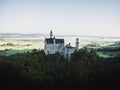 Aerial panorama sunrise view of bavarian alpine mountain landscape with Neuschwanstein fairytale castle Fuessen Germany