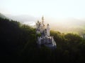 Aerial panorama sunset view of bavarian alpine mountain landscape with Neuschwanstein fairytale castle Fuessen Germany