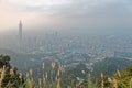 Aerial panorama of Taipei City at foggy dusk with view of Taipei buildings in downtown area Royalty Free Stock Photo