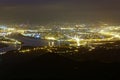 Aerial panorama of Taipei City in a misty gloomy night, with view of Guandu plain, Tamsui River and downtown area