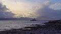 Aerial panorama view of the historic Fenit Lighthouse in Tralee Bay, beautiful clouds, sunset