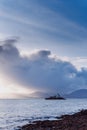 Aerial panorama view of the historic Fenit Lighthouse in Tralee Bay, beautiful clouds, sunset
