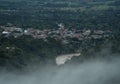 Aerial panorama view of houses buildings of Amazon rainforest jungle gateway city town Tarapoto in Peru South America