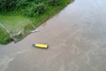 Aerial panorama view of the silty Amazon River and a water taxi with a yellow top Royalty Free Stock Photo