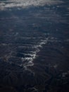 Aerial panorama view of snow covered mountain range peaks winter landscape seen from airplane window over Turkey Asia Royalty Free Stock Photo