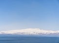 Aerial panorama view snow covered mountains. Snowy mountain ridge on winter sunrise. Stunning mountains range covered with snow Royalty Free Stock Photo