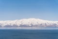 Aerial panorama view snow covered mountains. Snowy mountain ridge on winter sunrise. Stunning mountains range covered with snow Royalty Free Stock Photo