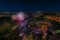 Aerial panoramic cityscape view with bright fireworks lights in night Munich.