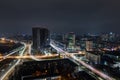 Aerial panoramic drone above roof view of Kiev night traffic road junction scene. Highway city at evening car light Royalty Free Stock Photo