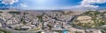 Aerial panoramic drone shot of Athens center with Oplymion Site, Lycabettus hill, acropolis