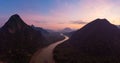 Aerial panoramic Nam Ou River Nong Khiaw Muang Ngoi Laos, sunset dramatic sky, scenic mountain landscape, famous travel Royalty Free Stock Photo