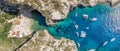 Aerial panoramic overhead drone shot of yachts at adriatic sea tourists at Stiniva beach on Vis Island in Croatia summer Royalty Free Stock Photo