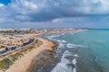 Aerial panoramic photo of La Mata Beach. Surfers ride the waves. Province of Alicante Costa Blanca. South of Spain Royalty Free Stock Photo