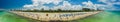 Aerial panoramic photo Miami Beach summer. Tourists sunbathing on Florida coastline iconic hotels visible on Ocean Drive