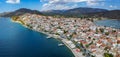 Aerial panoramic photo of picturesque seaside town of Ermioni built in peninsula with forest of Bistis at the end, Argolida, Royalty Free Stock Photo