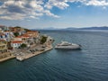 Aerial panoramic photo of picturesque seaside town of Ermioni built in peninsula with forest of Bistis at the end, Argolida, Royalty Free Stock Photo