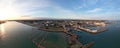 Aerial panoramic shot of a port with Southampton's buildings in the background, England