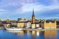 Aerial panoramic view of Riddarholmen with Church and swedish gothic buildings, ship sailing on Lake Malaren Sodermalm